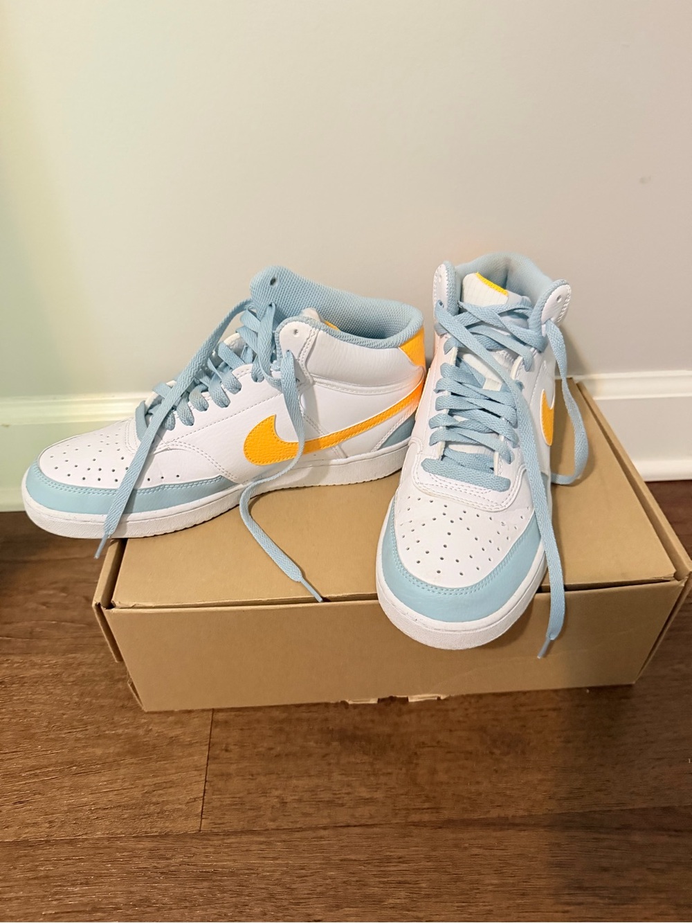 Nike White Sneakers with Light Blue and Yellow Accents